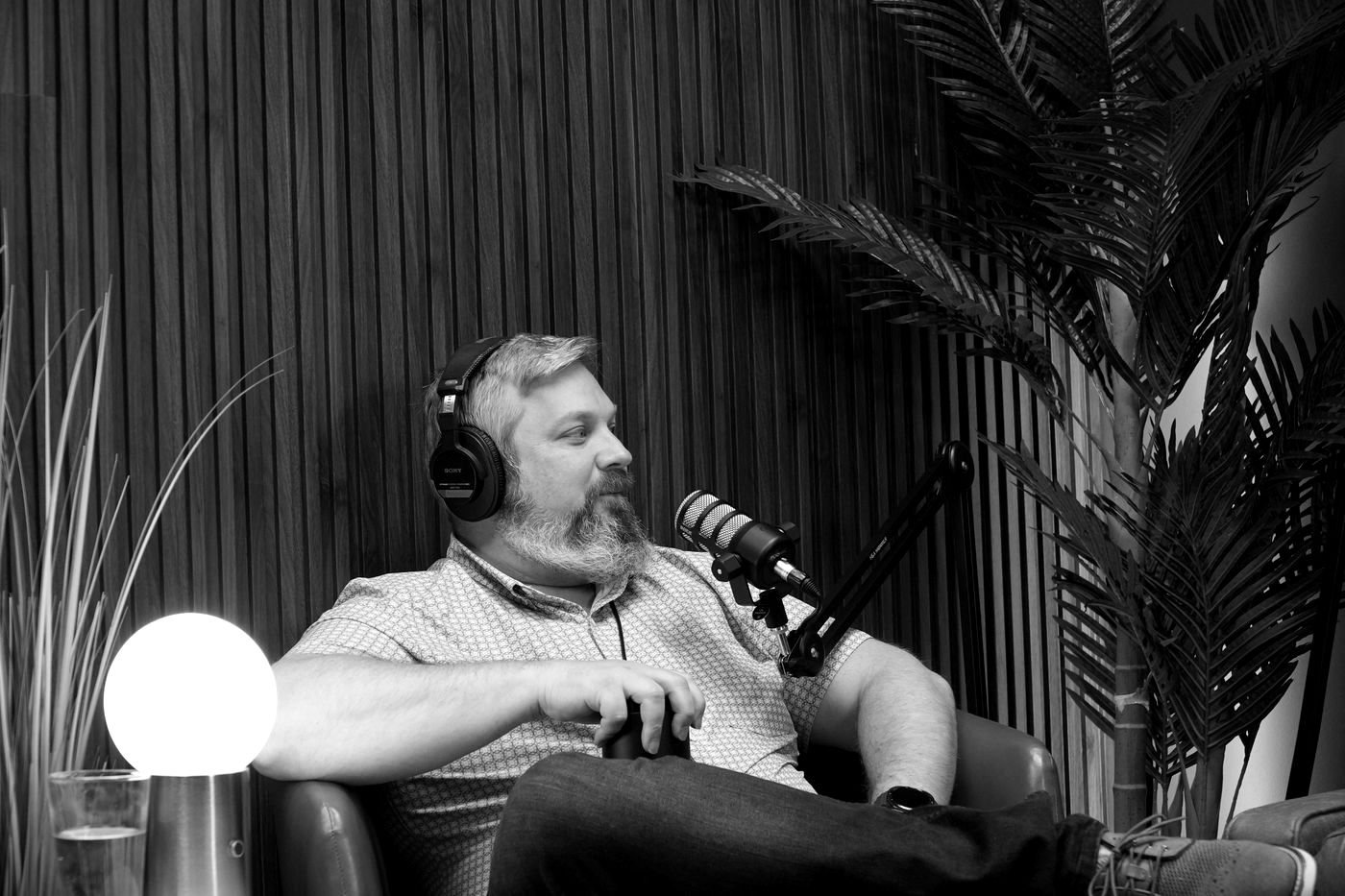 Justin listening attentively in a studio setting